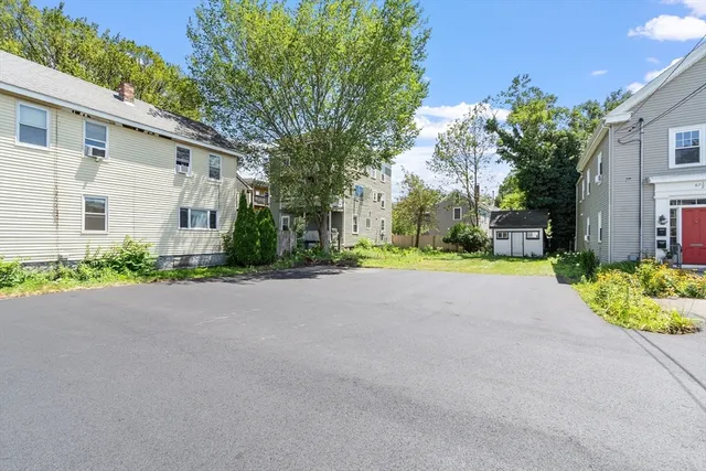 a view of house with outdoor space and garden