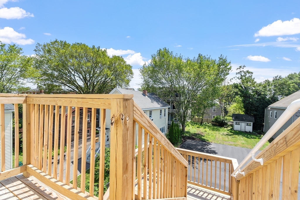 67 Essex Street, Unit 2 Salem, MA 01970 - Photo 30 of 35 a view of a wooden fence and a yard