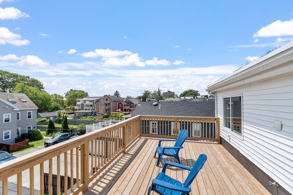 67 Essex Street, Unit 2 Salem, MA 01970 - Photo 5 of 35 a view of city from a balcony with furniture