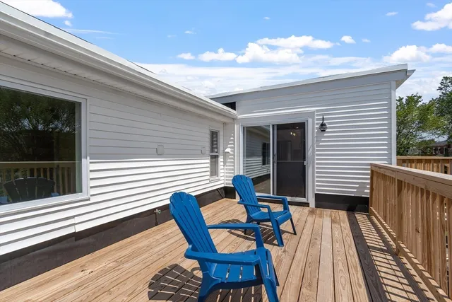 a view of a two chairs in the deck