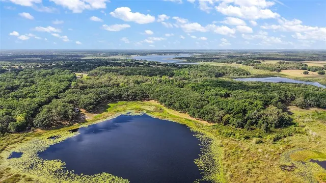 a view of a lake with a yard