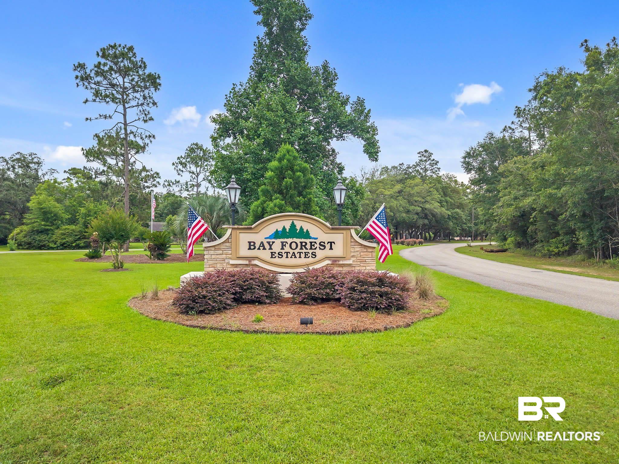 8145 Bay View Drive Foley, AL 36535 - Photo 73 of 81 Community sign with a lawn