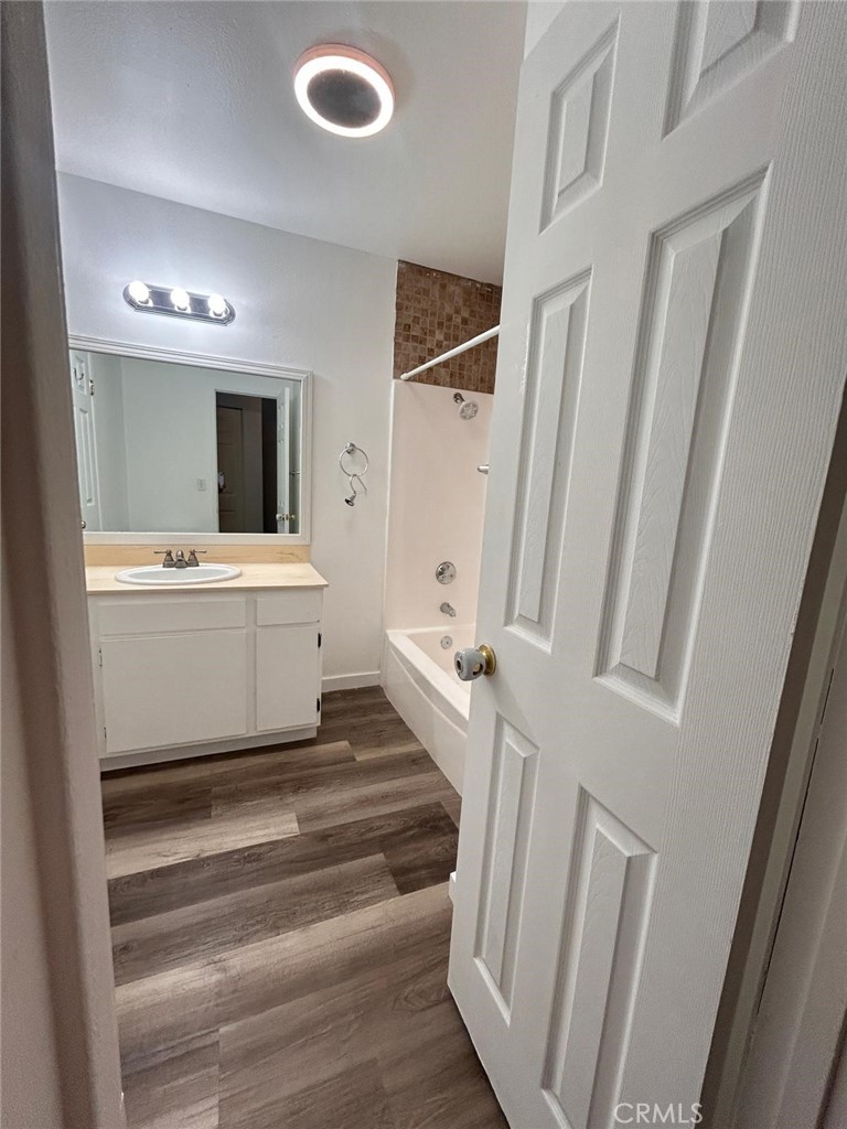 427 East Park Avenue, Unit 2 Santa Maria, CA 93454 - Photo 11 of 12 a spacious bathroom with a toilet a sink and mirror