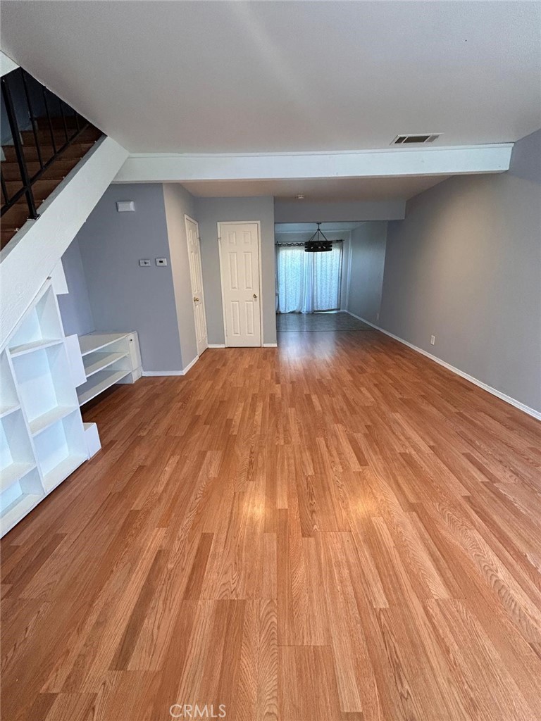 427 East Park Avenue, Unit 2 Santa Maria, CA 93454 - Photo 2 of 12 a view of empty room with wooden floor and fan