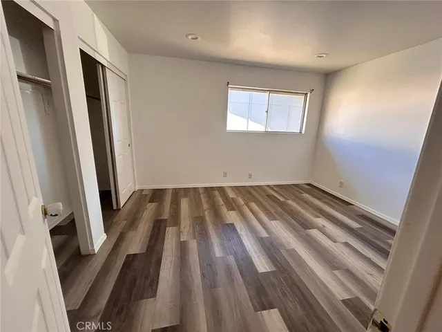a view of a hardwood floor in a room