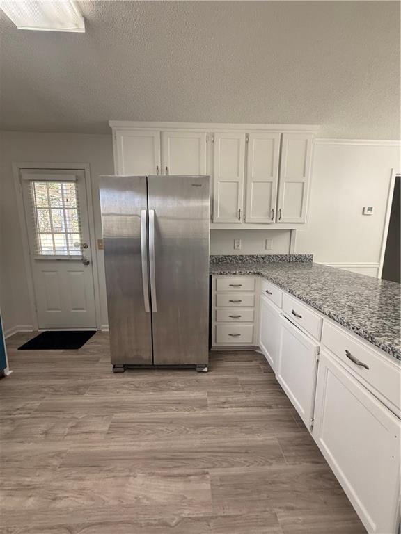 2540 Fortune Drive Dacula, GA 30019 - Photo 15 of 54 a kitchen with stainless steel appliances granite countertop a refrigerator sink and white cabinets