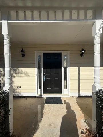 a view of a house with a door and a window