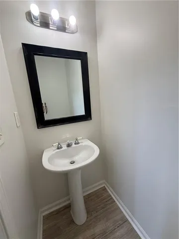 a view of a hallway view with wooden floor and staircase