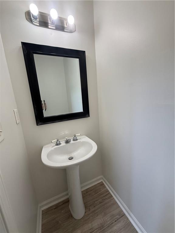 2540 Fortune Drive Dacula, GA 30019 - Photo 21 of 54 a bathroom with a toilet sink and mirror