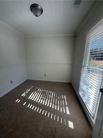 a view of an empty room and window