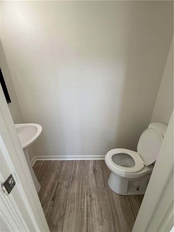 2540 Fortune Drive Dacula, GA 30019 - Photo 25 of 54 a white toilet sitting next to a white sink