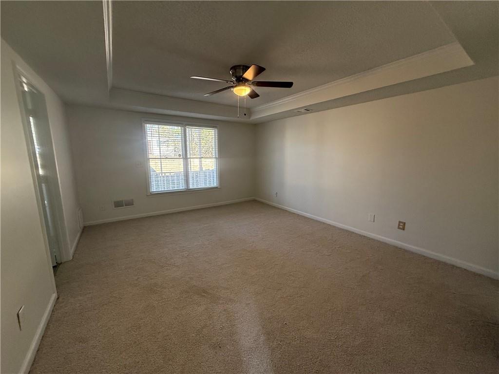 2540 Fortune Drive Dacula, GA 30019 - Photo 30 of 54 an empty room with a window and a ceiling fan