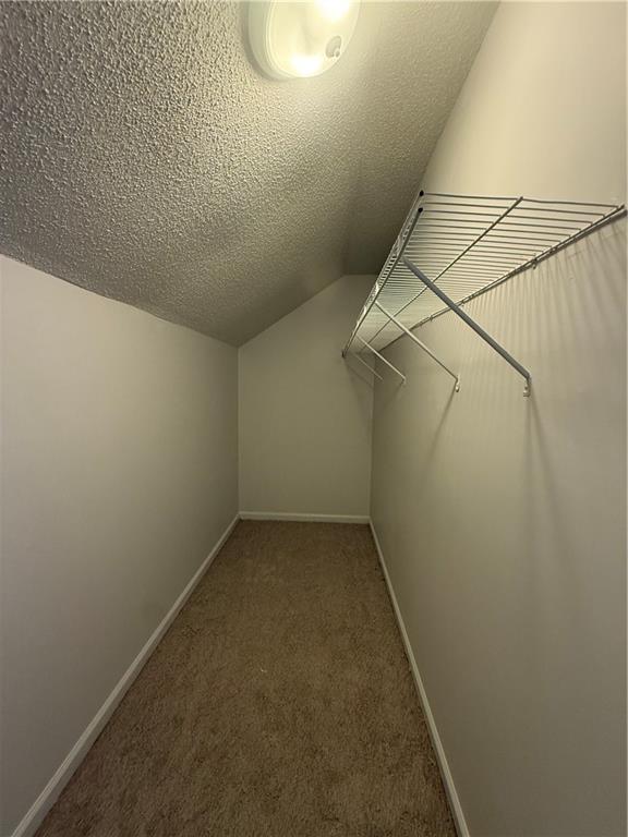 2540 Fortune Drive Dacula, GA 30019 - Photo 40 of 54 a view of a room with racks on the wall