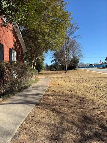a white toilet sitting in a bathroom next to a sink