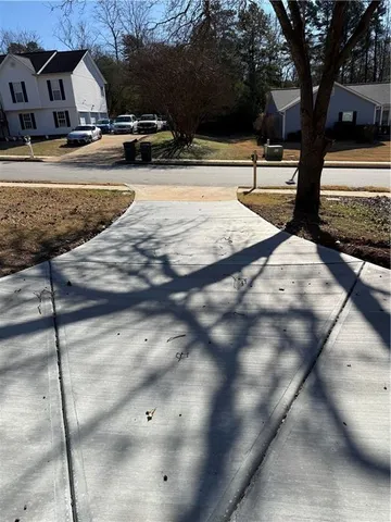 a view of empty room with white walls