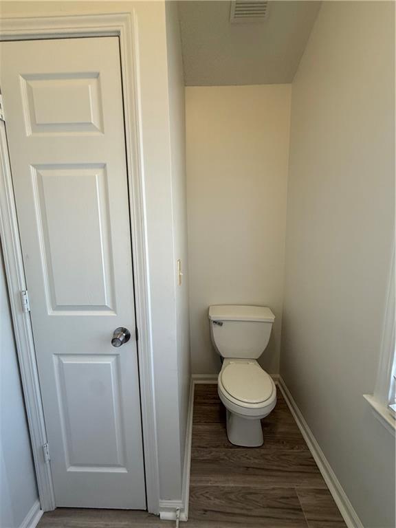 2540 Fortune Drive Dacula, GA 30019 - Photo 45 of 54 a white toilet sitting in a bathroom next to a sink