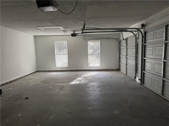 a view of a porch with wooden floor and fence