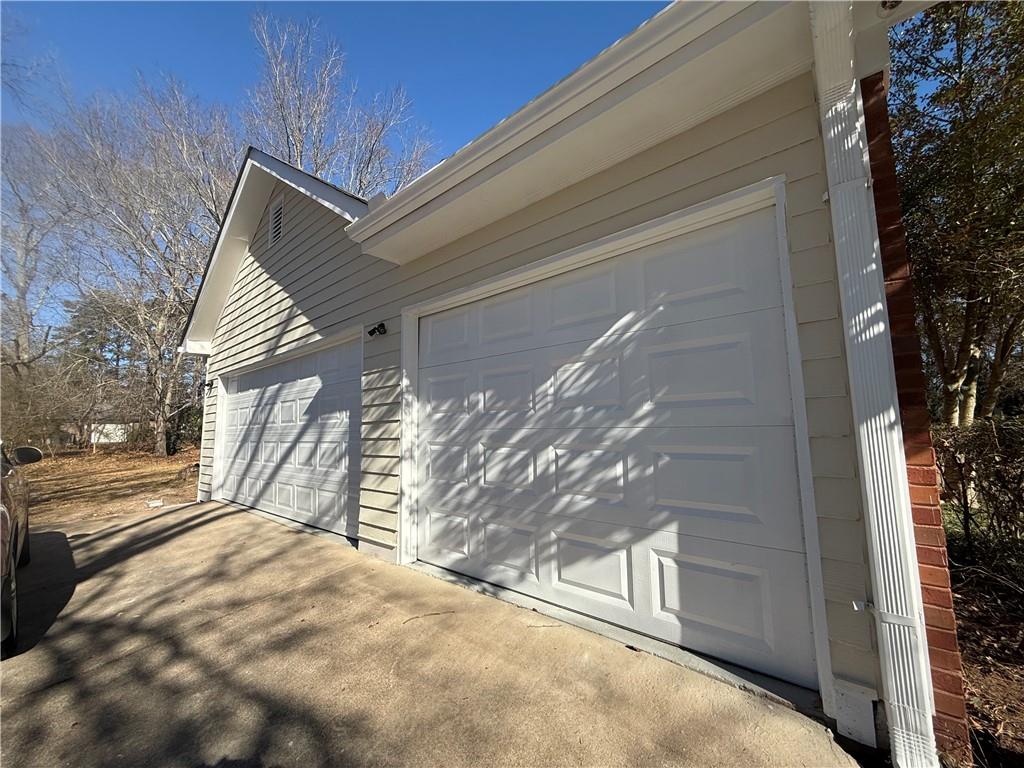 2540 Fortune Drive Dacula, GA 30019 - Photo 52 of 54 a view of a house with a yard and garage