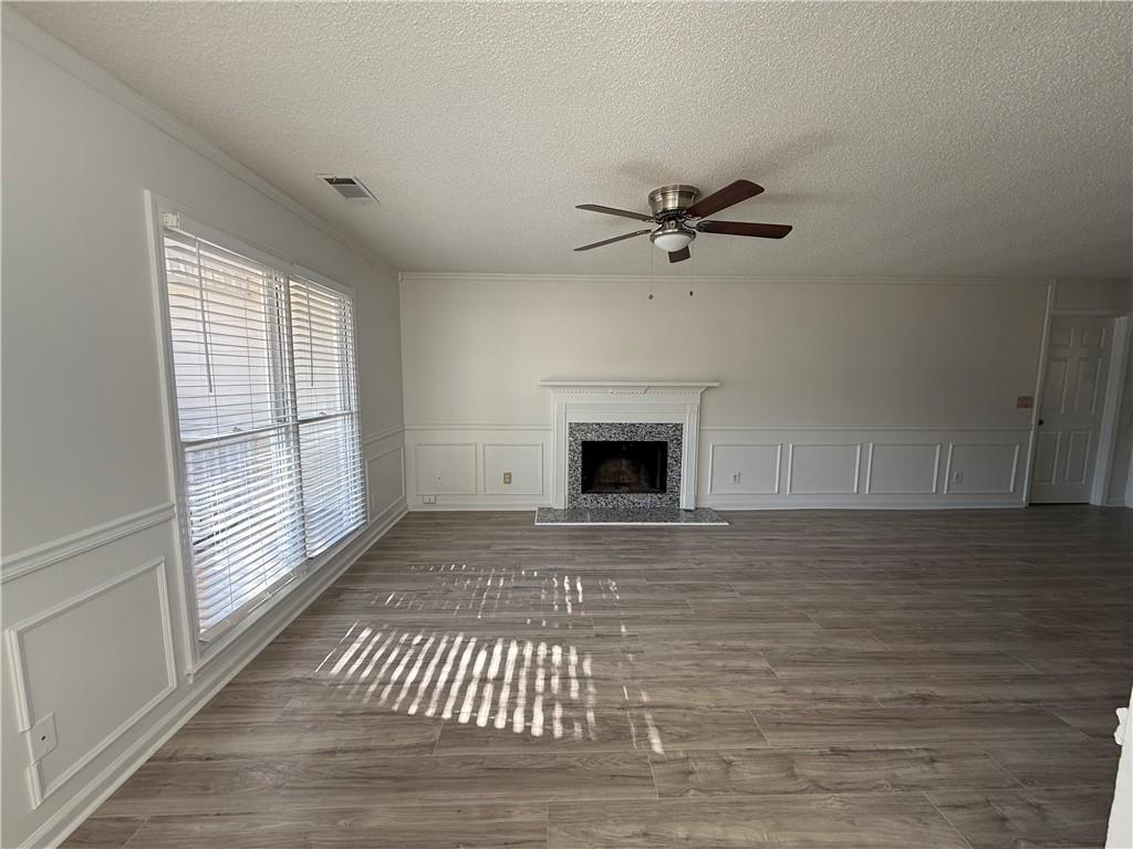 2540 Fortune Drive Dacula, GA 30019 - Photo 9 of 54 a view of an empty room with a fireplace and a window