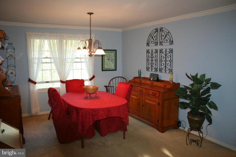 6620 Lewis Road Baldwin, MD 21013 - Photo 4 of 15 a dining room with furniture windows and a chandelier