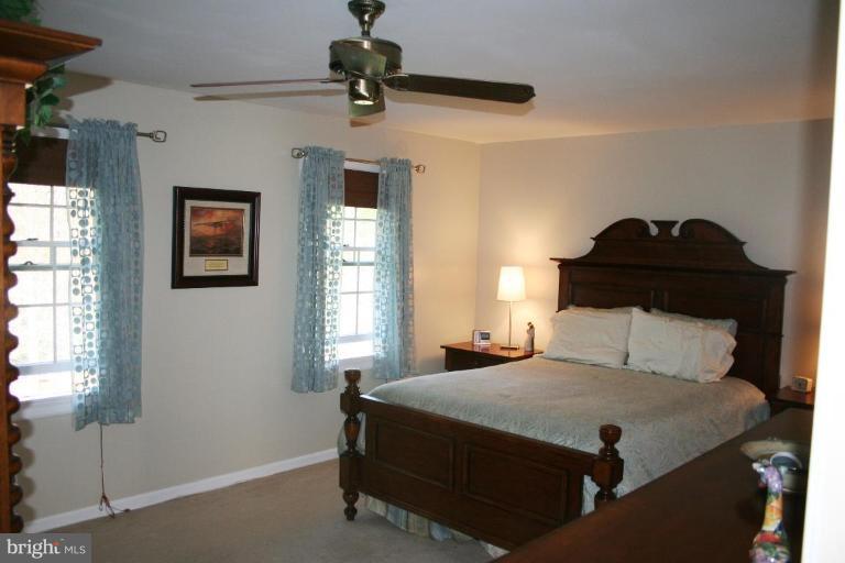 6620 Lewis Road Baldwin, MD 21013 - Photo 8 of 15 a bedroom with a bed and a window