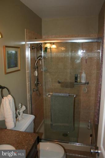 6620 Lewis Road Baldwin, MD 21013 - Photo 9 of 15 a bathroom with a granite countertop sink toilet and shower