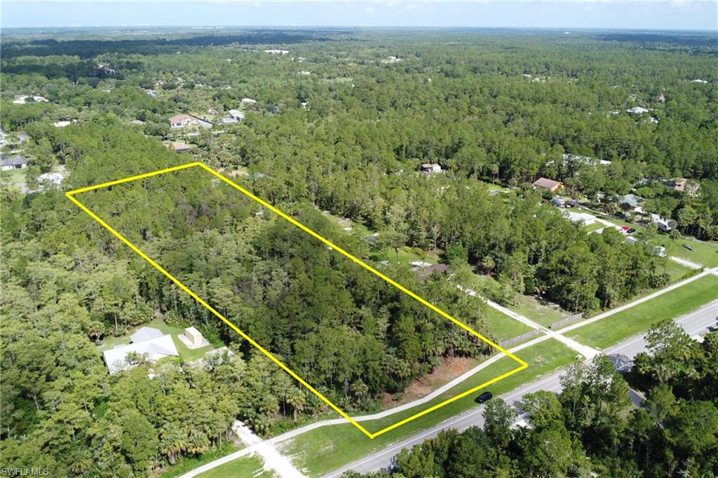 8th Street Northeast Naples, FL 34102 - Photo 2 of 10 Aerial overview of property's location featuring a forest and property parcel outlined