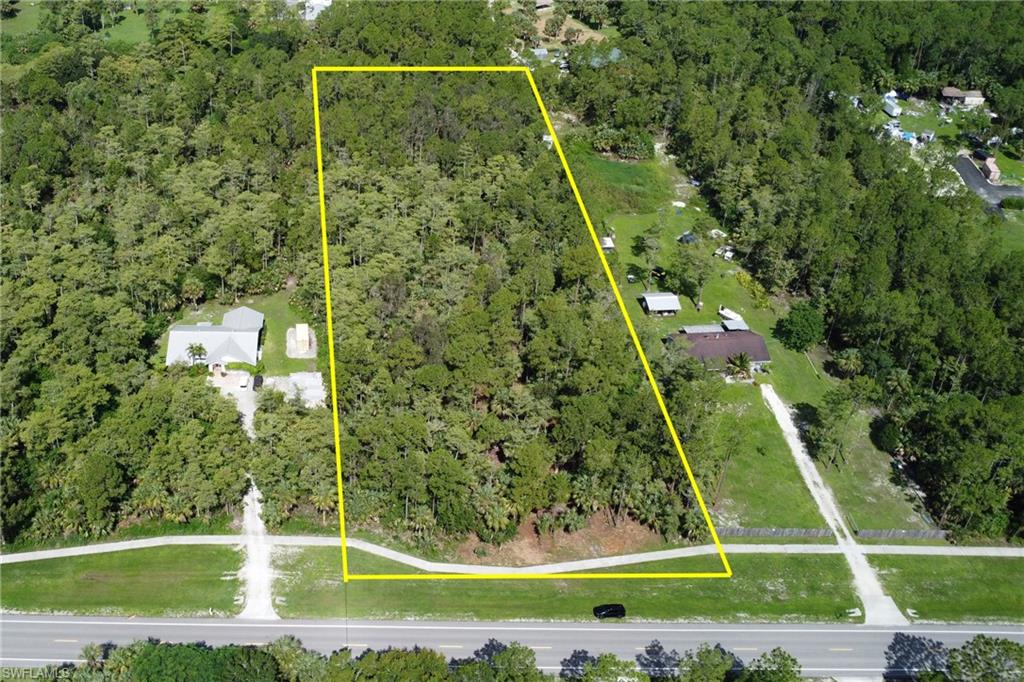 8th Street Northeast Naples, FL 34102 - Photo 9 of 10 Aerial overview of property's location with property boundaries highlighted and a heavily wooded area