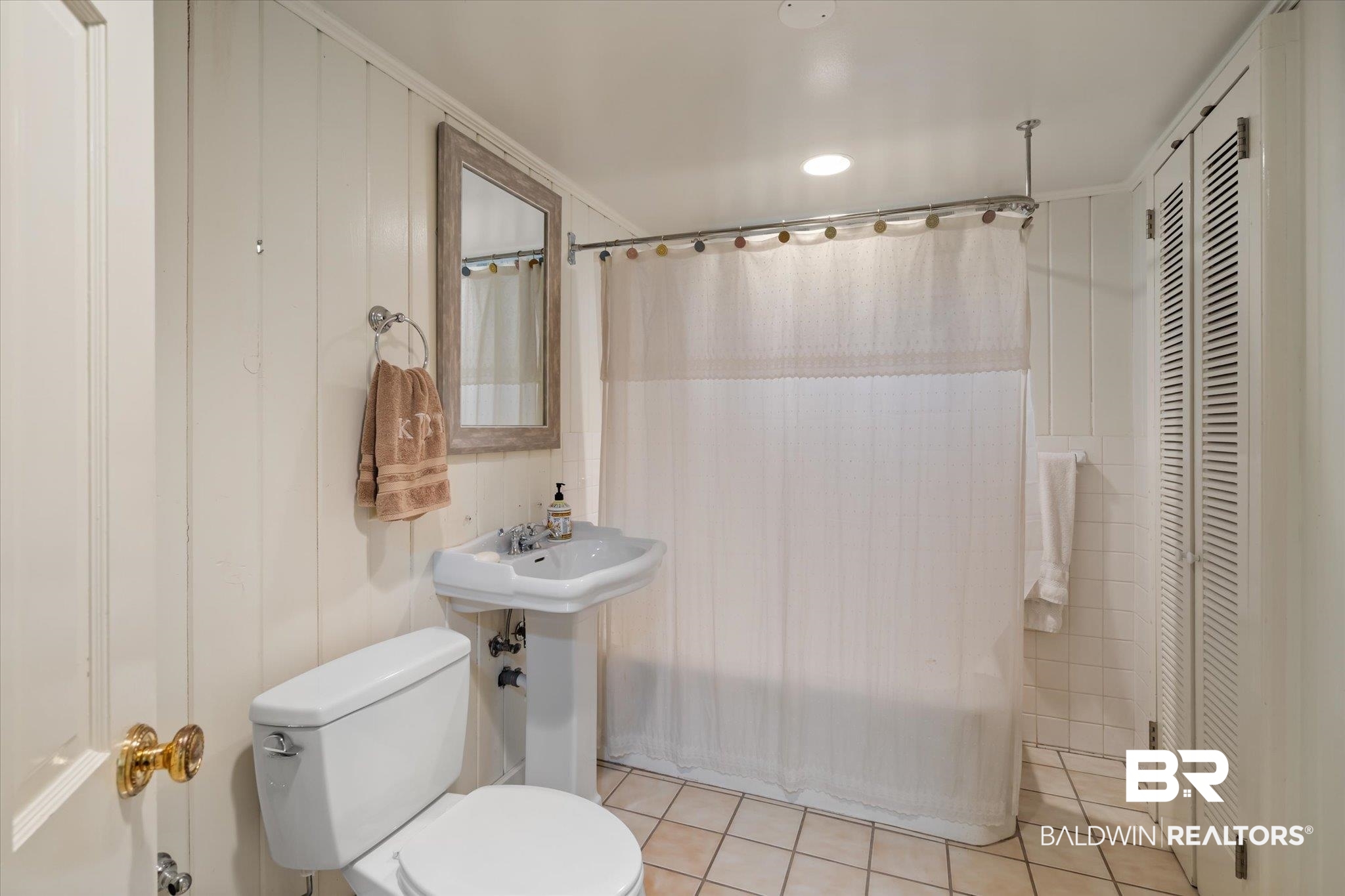 143 Myrtlewood Lane Mobile, AL 36608 - Photo 39 of 55 Bathroom featuring tile patterned floors, a closet, shower / bathtub combination with curtain, and toilet