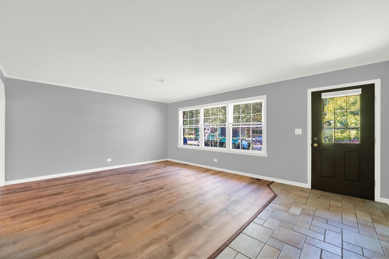7133 Edgebrook Lane Hanover Park, IL 60133 - Photo 13 of 26 a view of an empty room with wooden floor and a window