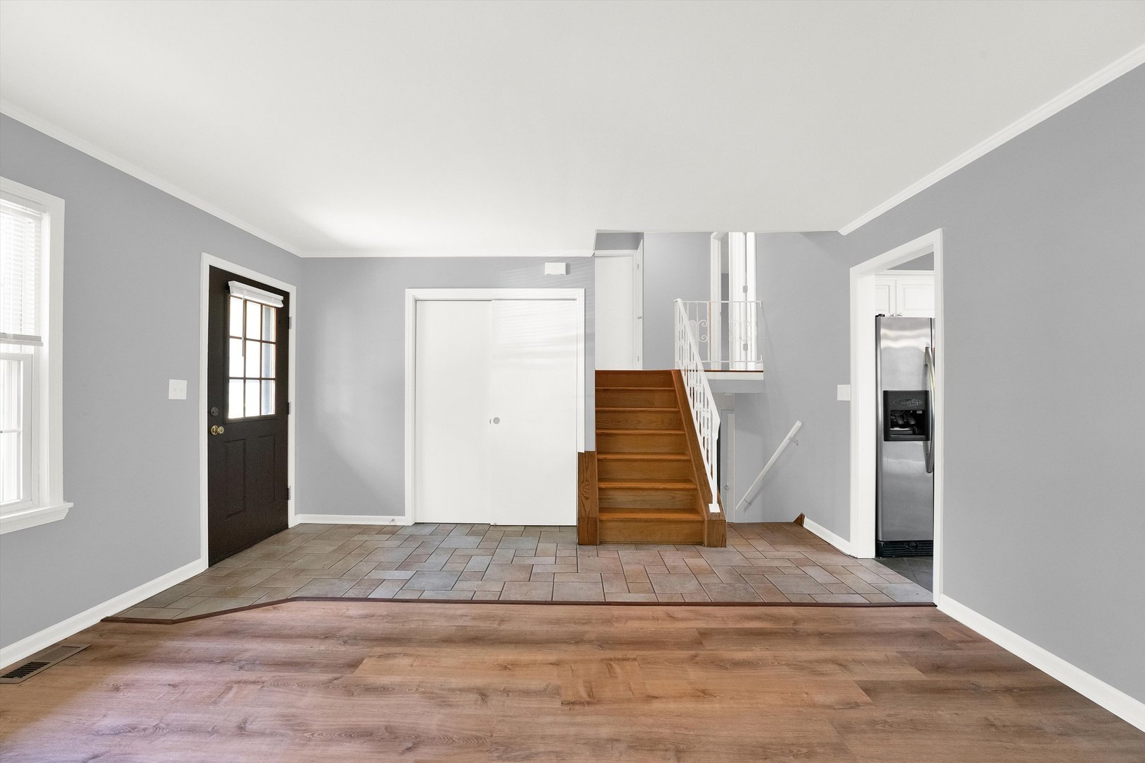 7133 Edgebrook Lane Hanover Park, IL 60133 - Photo 14 of 26 an empty room with wooden floor and windows
