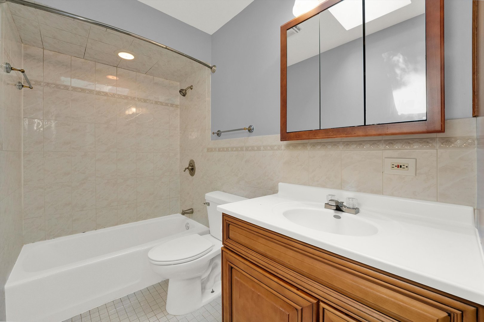 7133 Edgebrook Lane Hanover Park, IL 60133 - Photo 19 of 26 a bathroom with a sink a toilet and shower