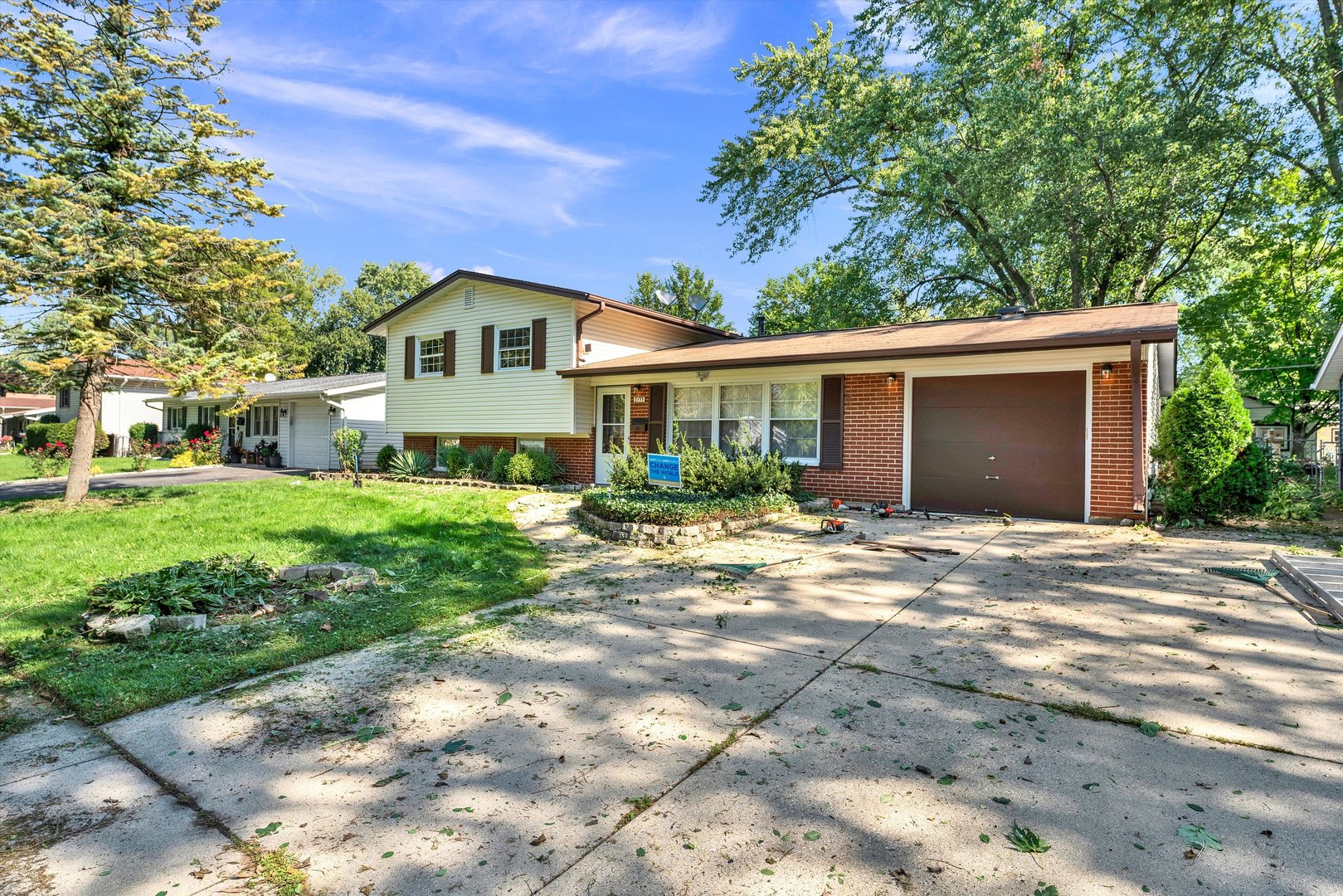 7133 Edgebrook Lane Hanover Park, IL 60133 - Photo 2 of 26 a front view of a house with a yard