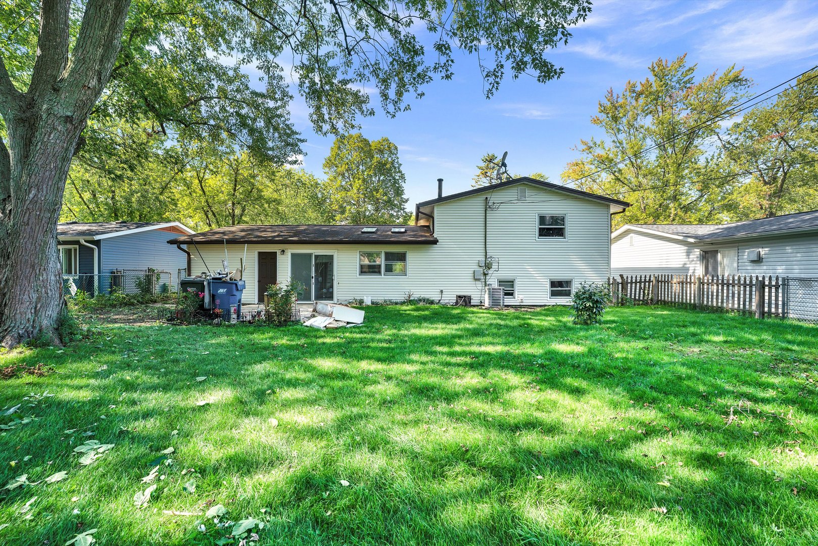 7133 Edgebrook Lane Hanover Park, IL 60133 - Photo 26 of 26 a view of a house with a yard and a garden