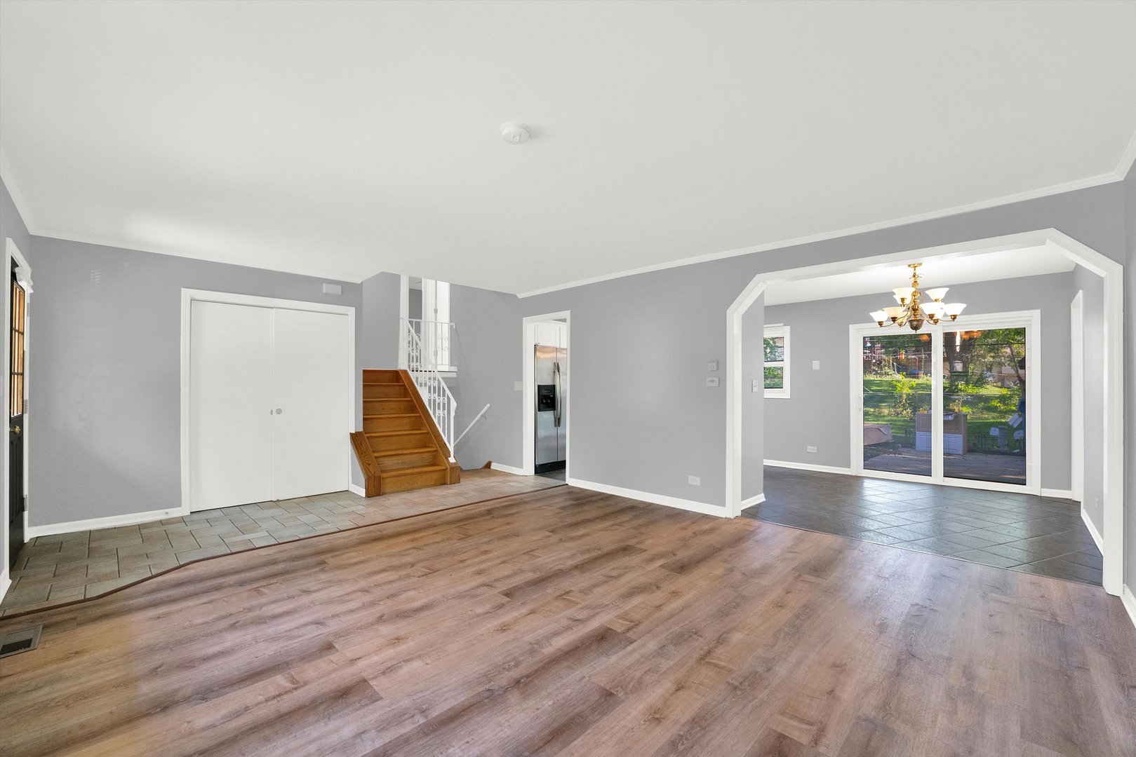 7133 Edgebrook Lane Hanover Park, IL 60133 - Photo 4 of 26 a view of empty room with wooden floor and fan