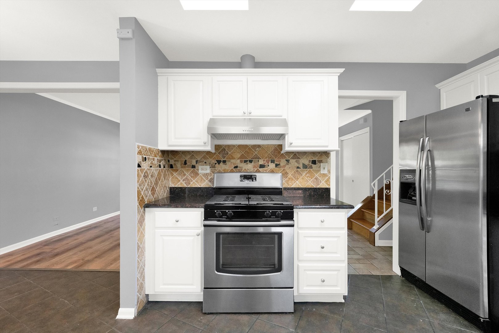 7133 Edgebrook Lane Hanover Park, IL 60133 - Photo 10 of 26 a kitchen with a stove and a refrigerator