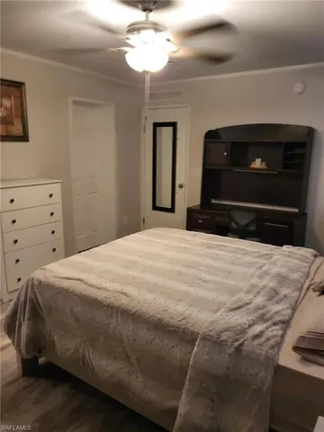 a bedroom with a bed and a fireplace
