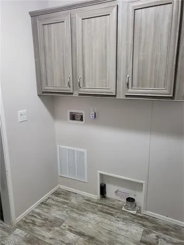 a view of cabinets and wooden floor