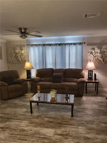 a living room with furniture and a couch