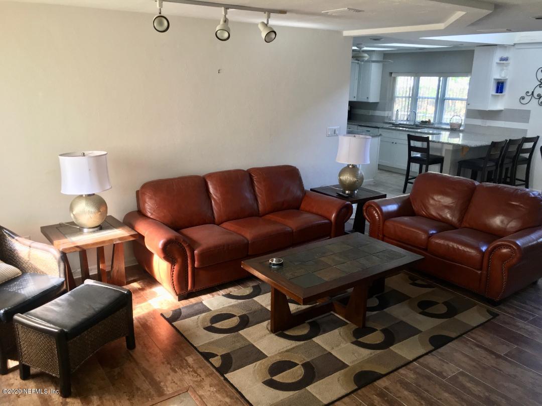 22 Bermuda Run Way St. Augustine, FL 32080 - Photo 12 of 30 a living room with furniture and a fireplace