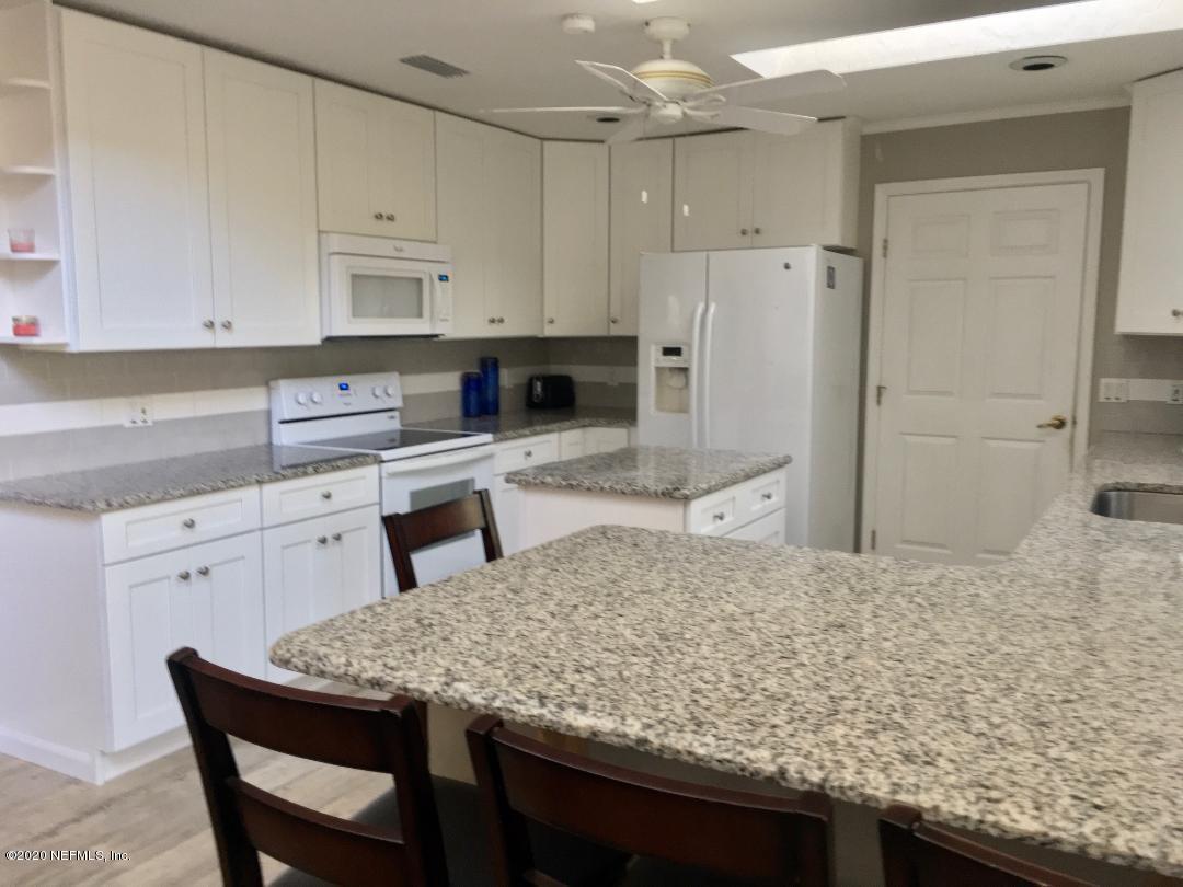 22 Bermuda Run Way St. Augustine, FL 32080 - Photo 19 of 30 a kitchen with granite countertop a sink stove and refrigerator