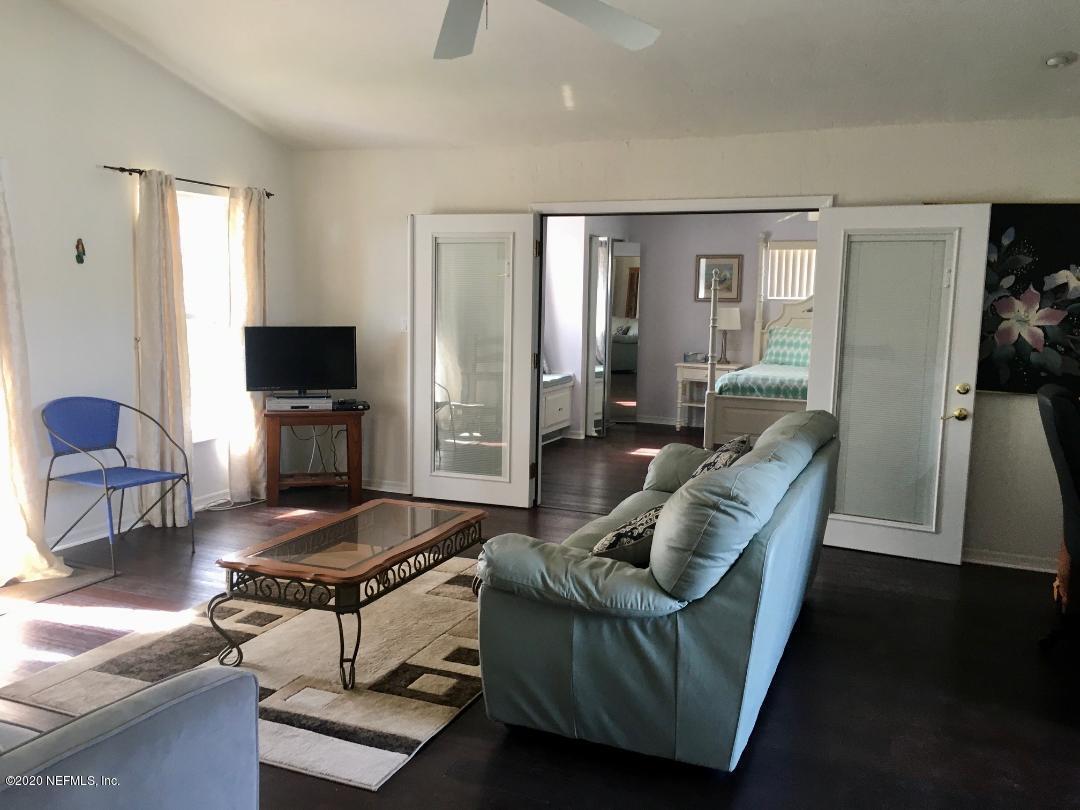 22 Bermuda Run Way St. Augustine, FL 32080 - Photo 21 of 30 a living room with furniture and a flat screen tv