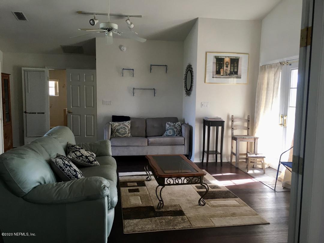22 Bermuda Run Way St. Augustine, FL 32080 - Photo 23 of 30 a living room with furniture and wooden floor