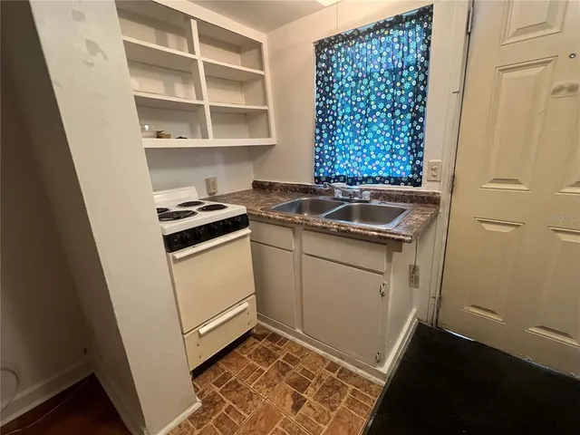 a white refrigerator freezer sitting inside of a kitchen