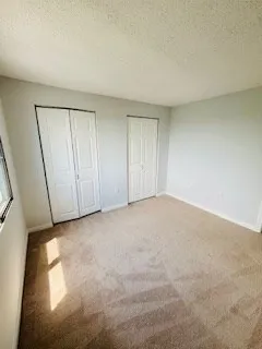 a view of an empty room and entryway