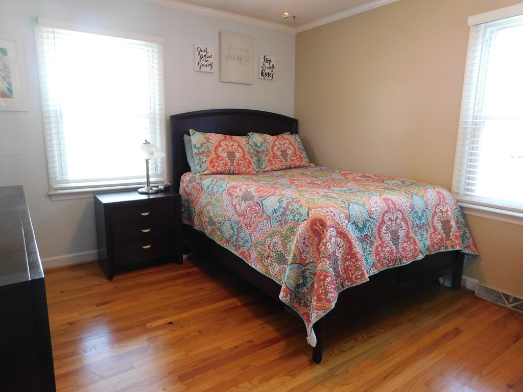 153 Joe Morris Road Kenly, NC 27542 - Photo 19 of 31 Master Bedroom with Beautiful Hardwood Flooring