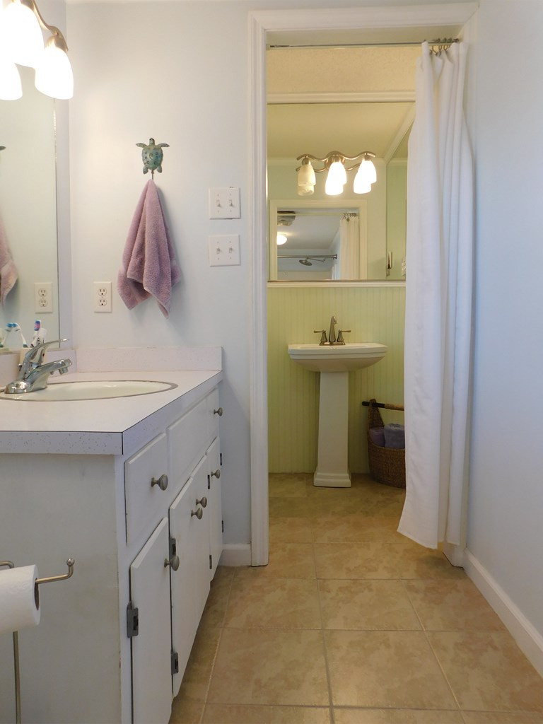 153 Joe Morris Road Kenly, NC 27542 - Photo 23 of 31 Master Bathroom with His and Hers Sinks