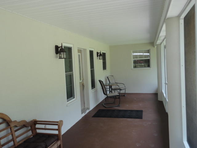 6404 Old River Road Baker, FL 32531 - Photo 11 of 28 a view of room with furniture and wooden floor