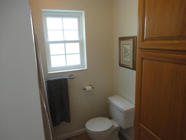 6404 Old River Road Baker, FL 32531 - Photo 13 of 28 a white toilet sitting next to a window