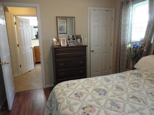 6404 Old River Road Baker, FL 32531 - Photo 15 of 28 a bedroom with a bed and a dresser